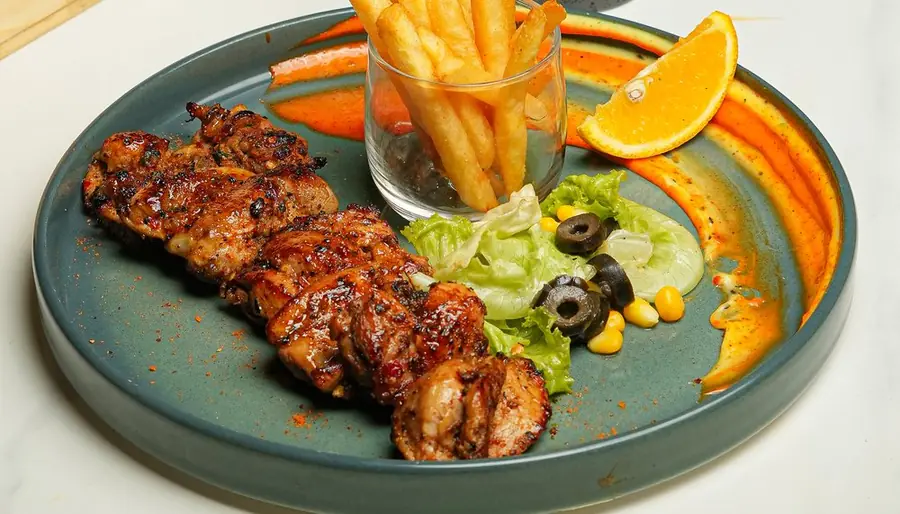 Jamaican jerk chicken with fries