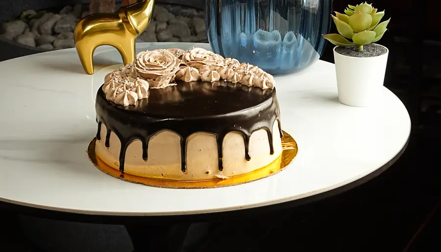 Chocolate drip cake on a stand